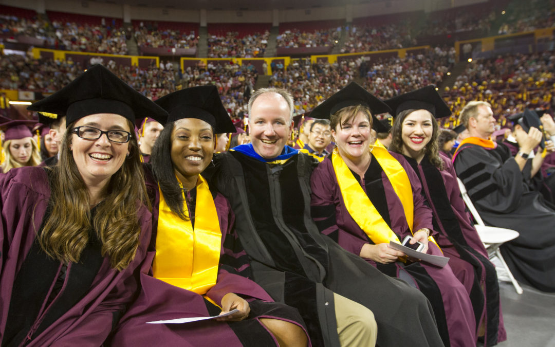 Paul Westerhoff and four students pose together for a photo while participating in the convocation cermony