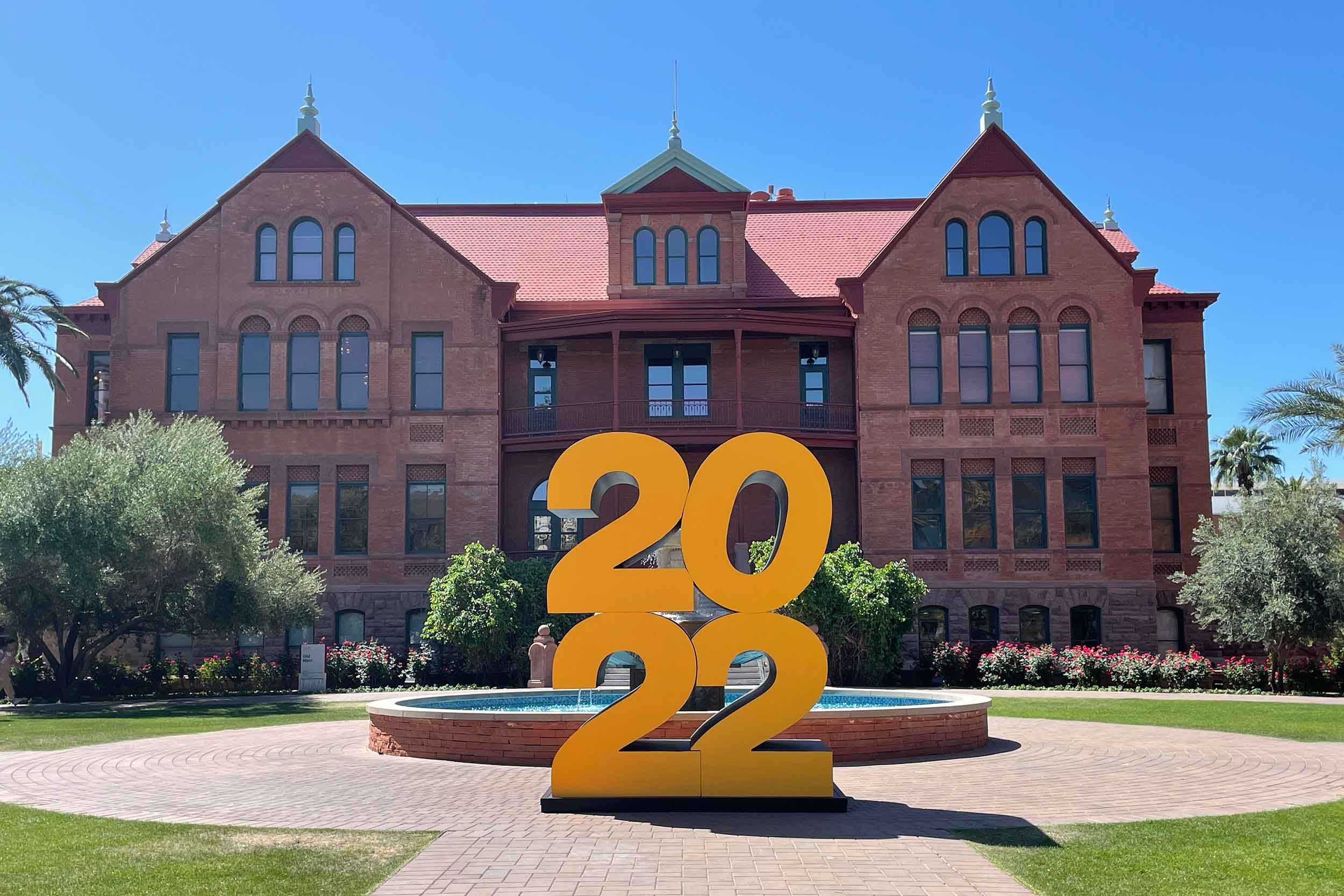 ASU's Old Main building with the gigantic "2022" statue in front of it.