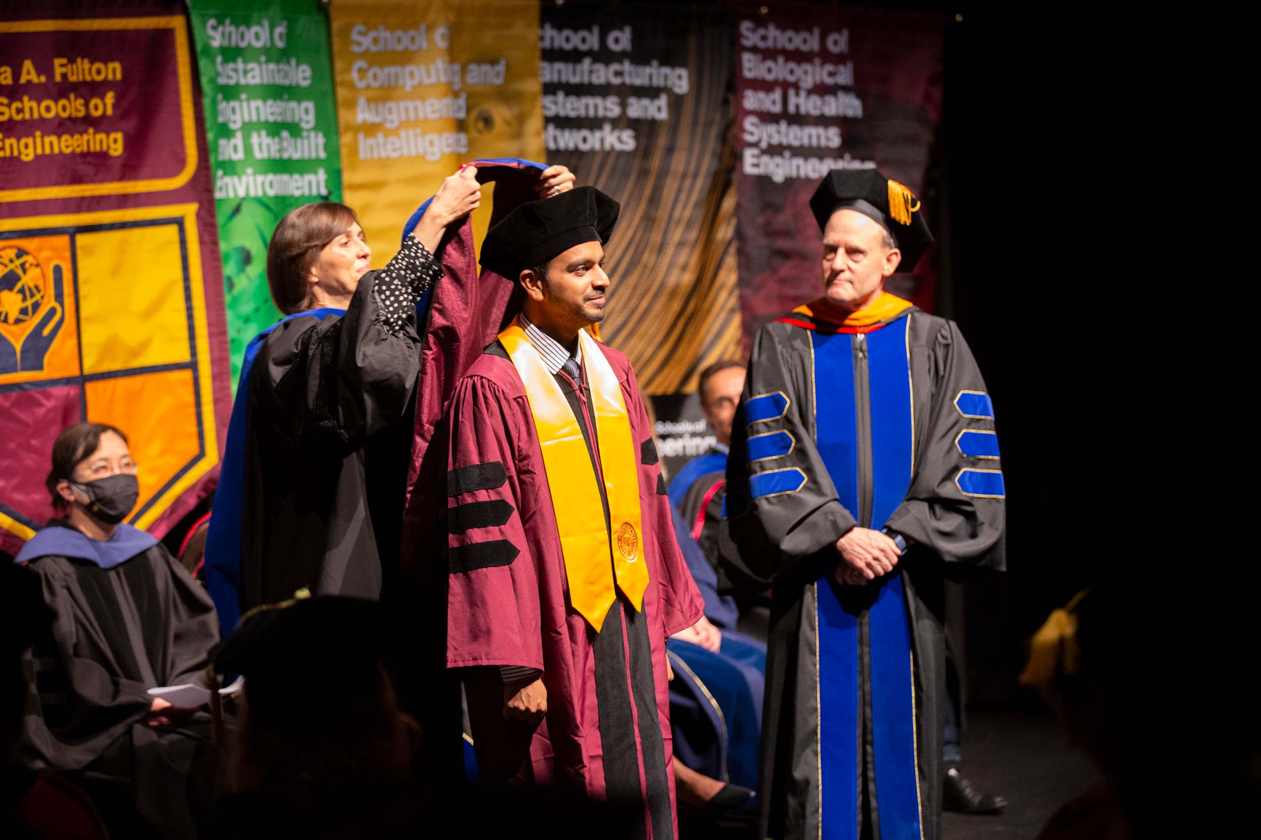 A doctoral graduate is hooded by his advisor at the Spring 2022 PhD Hooding Ceremony for ASU Engineering