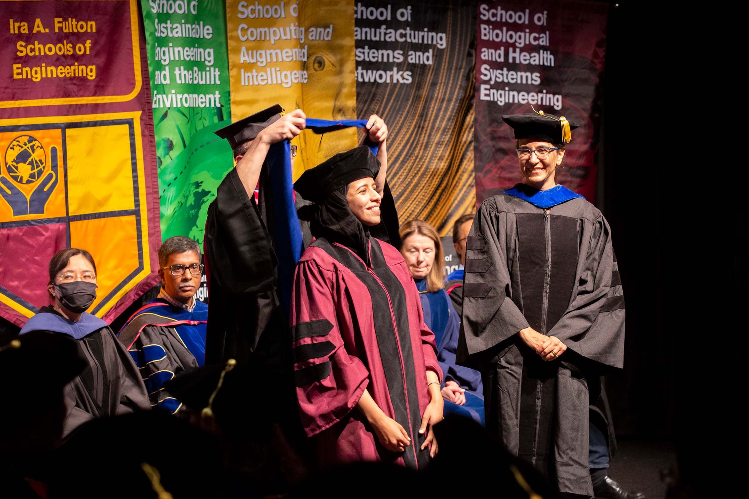A doctoral graduate is hooded by her advisor at the Spring 2022 PhD Hooding Ceremony for ASU Engineering