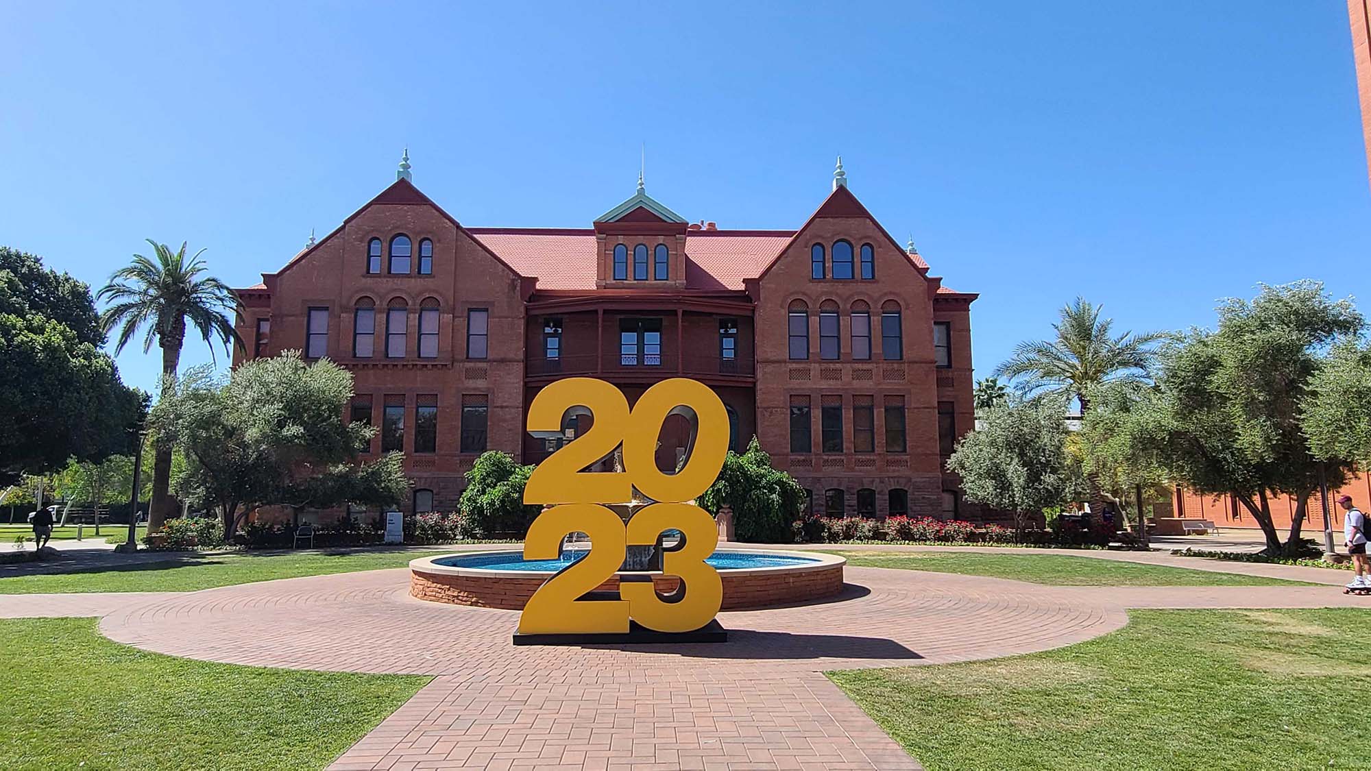 ASU's Old Main building with the gigantic "2023" statue in front of it.