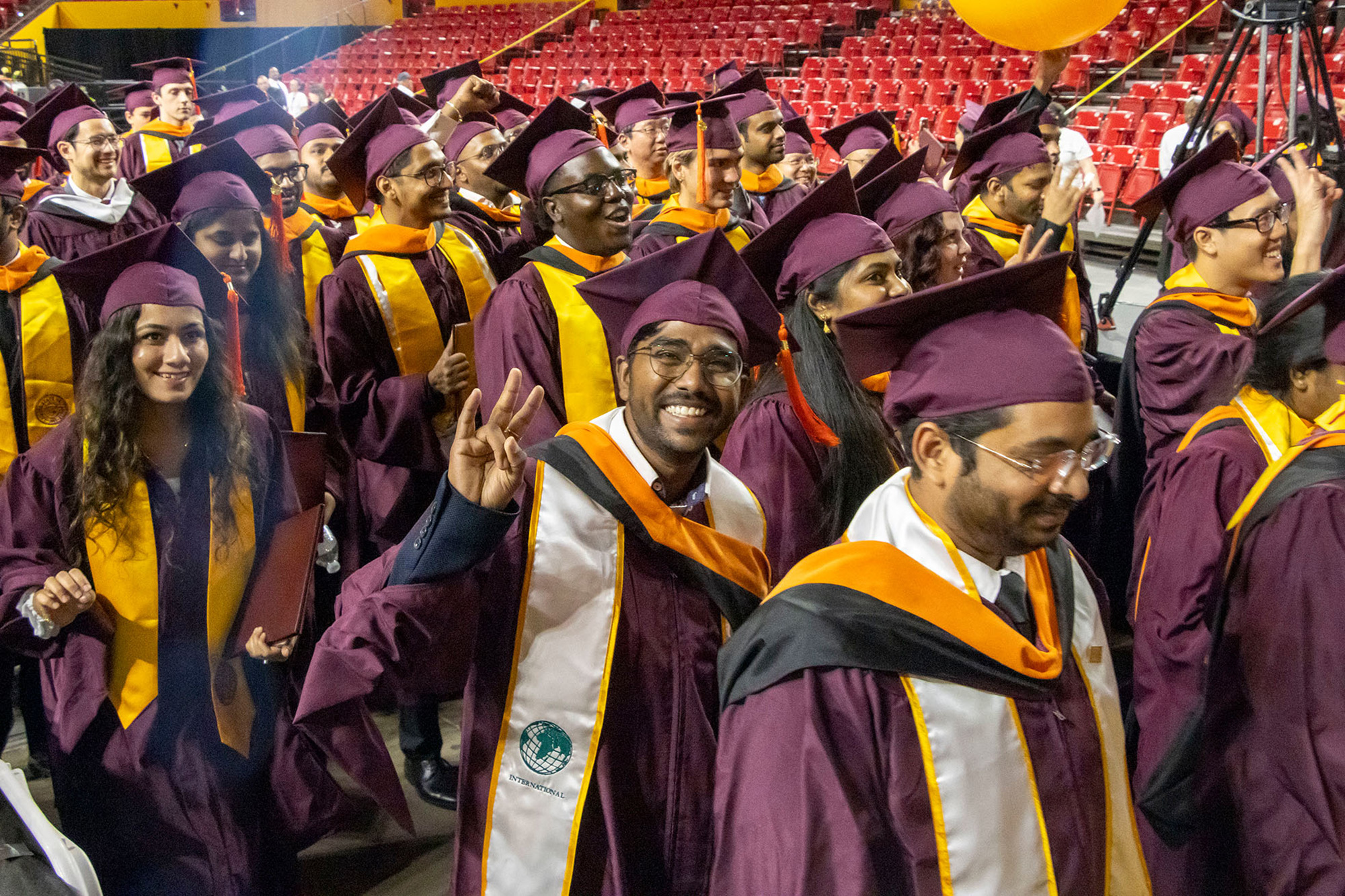Hundreds of happy ASU Engineering graduates exit the arena after the Fall 2023 Graduate Convocation ceremony.