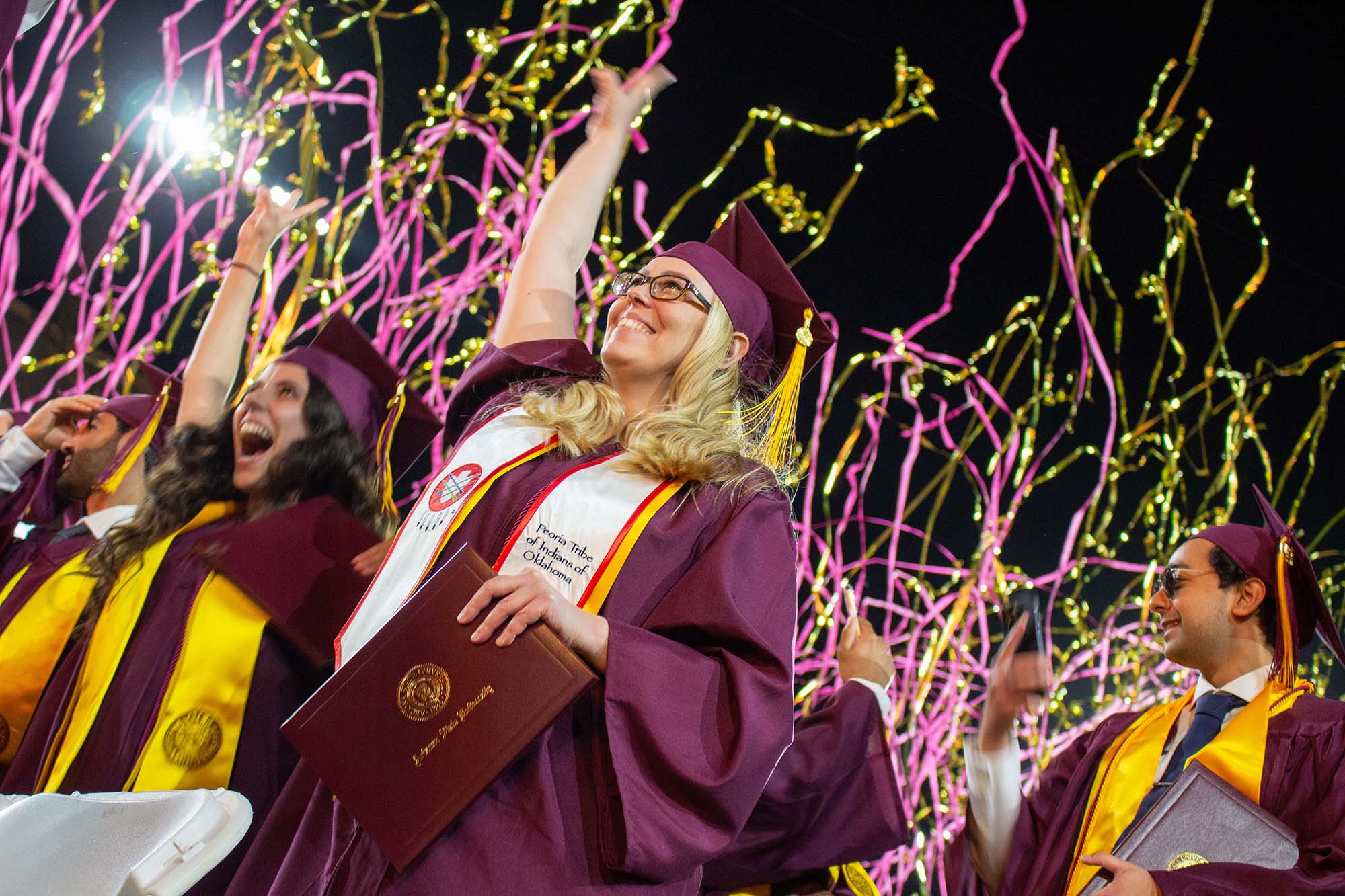 A woman graduate celebrates at the Spring 2023 Fulton Schools Convocation