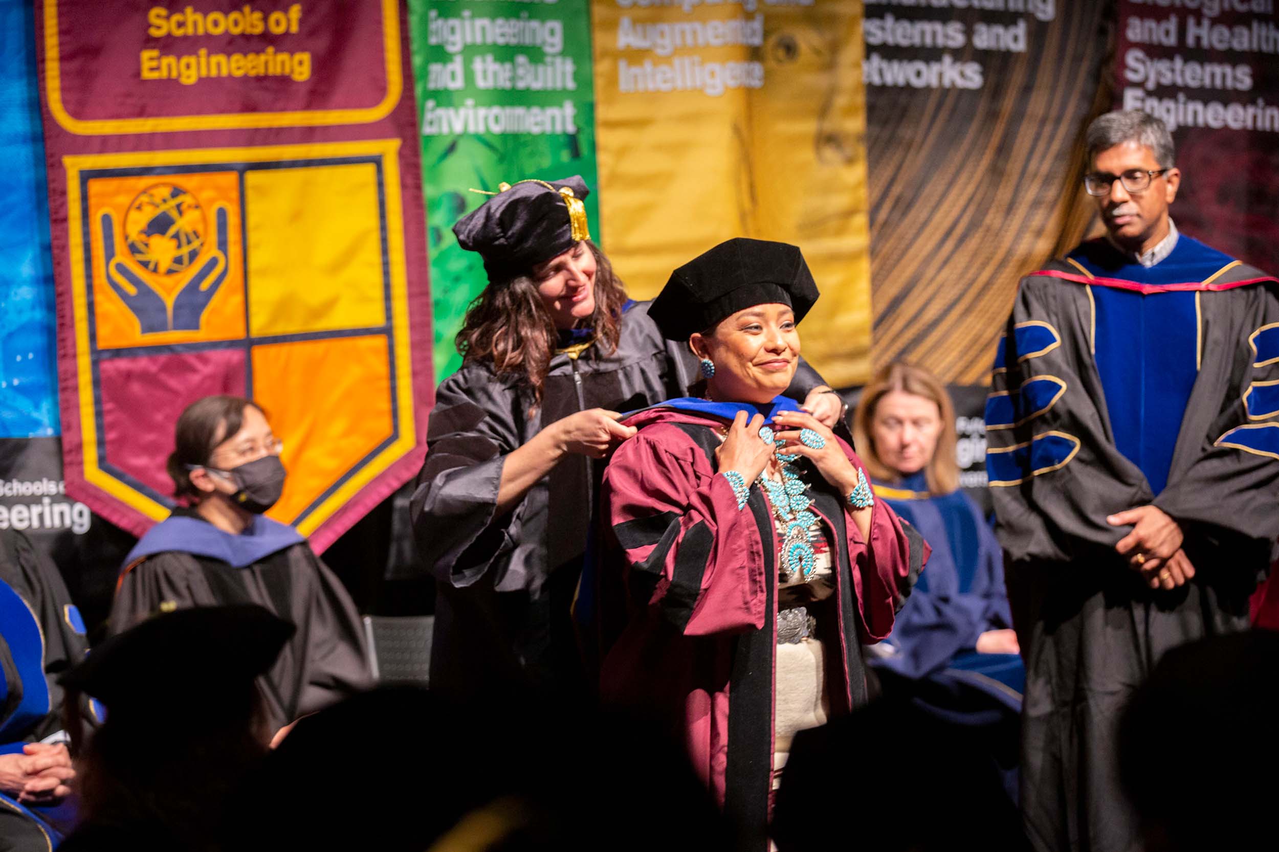 A doctoral graduate is hooded by her advisor at the Spring 2022 PhD Hooding Ceremony for ASU Engineering